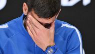 Serbia's Novak Djokovic attends a press conference after losing against Italy's Jannik Sinner on January 26, 2024. (Photo by Saeed Khan / AFP)