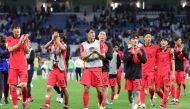 South Korea players walk off the pitch after their win. Pics: Rajan Vadakkemuriyil / The Peninsula
