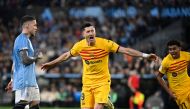 Barcelona's Polish forward #09 Robert Lewandowski celebrates scoring his team's first goal during the Spanish league football match between RC Celta de Vigo and FC Barcelona at the Balaidos stadium in Vigo on February 17, 2024. (Photo by MIGUEL RIOPA / AFP)
