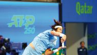 Zhang Zhizhen hits a return against Lorenzo Musetti during their Round of 32 match of the Qatar ExxonMobil Open, yesterday. 
