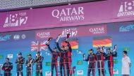 The podium winners of the inaugural Qatar Airways Qatar 1812 KM celebrate at Lusail International Circuit yesterday.
