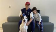 Alan Moncayo with his 5-year-old daughter Sabrina and their recently adopted dog, Jihoo. (Photo by Fairfax County Animal Shelter via Washington Post)