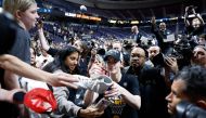 Caitlin Clark #22 of the Iowa Hawkeyes signs autographs after beating the LSU Tigers 94-87 in the Elite 8 round of the NCAA Women's Basketball Tournament at MVP Arena on April 01, 2024 in Albany, New York. (Photo by Sarah Stier / GETTY IMAGES NORTH AMERICA / Getty Images via AFP)