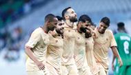 Al Markhiya players celebrate after winning the match.