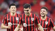 Al Rayyan's Achraf Bencharki (centre) celebrates with teammates after scoring the goal against Muaither yesterday. 