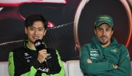 Kick Sauber's Chinese driver Zhou Guanyu (L) speaks as Aston Martin's Spanish driver Fernando Alonso (R) listens during a presse conference at the Shanghai International circuit ahead of the Formula One Chinese Grand Prix in Shanghai on April 18, 2024. (Photo by Hector RETAMAL / AFP)