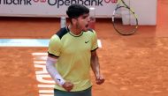 Spain's Carlos Alcaraz celebrates victory at the end of the third round of the 2024 ATP Tour Madrid Open tournament tennis match against Brazil's Thiago Seyboth Wild at Caja Magica in Madrid on April 28, 2024. (Photo by Thomas COEX / AFP)
