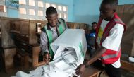 Electoral officials prepare the counting of votes at a polling station in Lome on April 29, 2024, during Togo's legislative elections. (Photo by Emile KOUTON / AFP)
