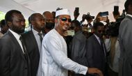 (FILES) Chad's transitional president and presidential election candidate Mahamat Idriss Deby Itno (C) casts his ballot at a polling station in N'Djamena on May 6, 2024 during Chad's presidential election. (Photo by Issouf SANOGO / AFP)
