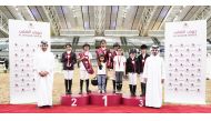 The winners of the Intro 40 cm category pose for a photograph with officials.   