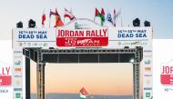 Qatar's Nasser Saleh Al Attiyah waves a flag at the start of the Jordan Rally, yesterday.