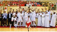 Al Arabi players and officials celebrate with the Amir Cup trophy after winning the final against Al Sadd yesterday. Al Arabi President Sheikh Tamim bin Fahd Al Thani received the trophy from the First Vice President of Qatar Olympic Committee Mohammed bin Yousef Al Mana, in the presence of the Qatar Basketball Association President Mohammed Saad Al Mughaiseeb.
