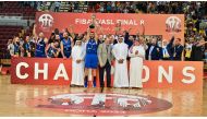 Al Riyadi players celebrate with the FIBA West Asia Super League Final 8 trophy after defeating Sagesse in the final played at the Lusail Multipurpose Hall, yesterday. 