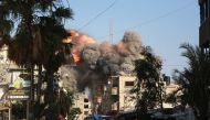 A ball of fire and black smoke rises moments after an Israeli air strike targeted a residential building in the city of Bureij in the central Gaza Strip on June 3, 2024. (Photo by Bashar Taleb / AFP)

