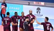 Qatar players celebrate after scoring a point against China.