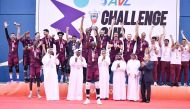 Qatar players celebrate on the podium after winning the Asian Men’s Volleyball Challenge Cup title, yesterday.