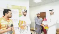 NHRC officials handing over various products to workers as part of the awareness drive.