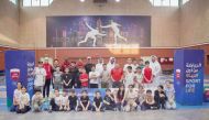 The participants pose for a photo with officials.