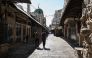 Palestinians walk through deserted commercial area in Nablus, occupied West Bank. AFP file photo.
