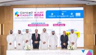 Officials during signing ceremony held in Doha yesterday.