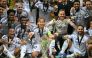 Real Madrid's player celebrate with the trophy after the UEFA Super Cup football match between Real Madrid and Atalanta BC in Warsaw, on August 14, 2024. (Photo by Sergei GAPON / AFP)

