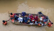 Volunteers rescue flood-affected residents in Feni, in south-eastern Bangladesh, on August 23, 2024. (Photo by Munir Uz Zaman / AFP)

