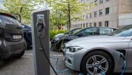 File: Electric cars are being charged on a street in the Norwegian capital Oslo on April 30, 2019. (Photo by Jonathan Nackstrand / AFP)

