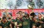 South Africa's flanker Siya Kolisi (C) lifts the trophy while kissing his wrist as he celebrates with his teammates after they won the Rugby Championship following their match between South Africa and Argentina at Mbombela Stadium in Mbombela on September 28, 2024. (Photo by PHILL MAGAKOE / AFP)
