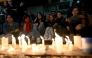 Fans of British singer Liam Payne lit candles next to the hotel where he died in Buenos Aires on October 16, 2024. Photo by Luis ROBAYO / AFP