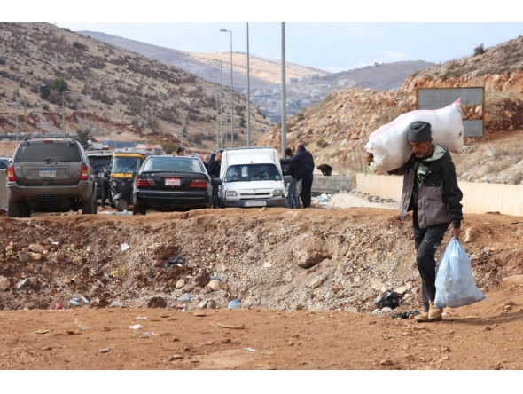 Lebanese man fleeing Israeli airstrikes. AFP file photo.