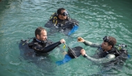Participants cleaning the seabed.