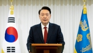 This handout photo taken on December 14, 2024 and released by the South Korean Presidential Office shows President Yoon Suk Yeol giving a public address from his official residence in Seoul. Photo by Handout / South Korean Presidential Office / AFP

