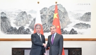 Chinese Foreign Minister Wang Yi, also a member of the Political Bureau of the Communist Party of China Central Committee, holds talks with Japanese Minister for Foreign Affairs Takeshi Iwaya in Beijing, capital of China, Dec. 25, 2024. (Xinhua/Li Xiang)
