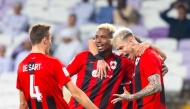 Al Rayyan players celebrate after Roger Guedes (right) scored their second goal.