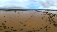 This handout photo taken on March 29, 2025 and released by The Queensland Fire Department shows homes under floodwaters in the town of Windorah in central-west Queensland. Photo by Handout / QUEENSLAND FIRE DEPARTMENT / AFP