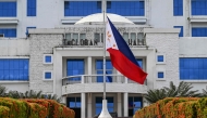 This photo shows the Philippine national flag flying at half-mast at the city hall in Tacloban City, province of Leyte on April 22, 2025, a day after the death of Pope Francis. Photo by Jam STA ROSA / AFP