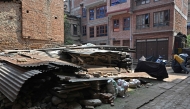 This photograph taken on April 16, 2025 shows remains of the 2015 earthquake, at a residential colony in Bhaktapur on the outskirts of Kathmandu. (Photo by Prakash Mathema / AFP) 