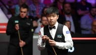 Zhao Xintong (R) and Ronnie O'Sullivan compete during the semifinal match between Ronnie O'Sullivan of England and Zhao Xintong of China at World Snooker Championship 2025 in Sheffield, Britain, May 2, 2025. (Photo by Zhai Zheng/Xinhua)
