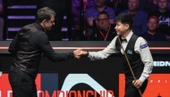 Zhao Xintong (R) greets Ronnie O'Sullivan before the semifinal match between Ronnie O'Sullivan of England and Zhao Xintong of China at World Snooker Championship 2025 in Sheffield, Britain, May 2, 2025. (Photo by Zhai Zheng/Xinhua)
