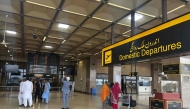 Passengers wait at Jinnah International airport after all domestic and international flights were cancelled in Karachi on May 7, 2025. (Photo by Asif Hassan / AFP)
