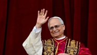 Newly elected Pope Leo XIV, Robert Prevost addresses the crowd from the main central loggia balcony of the St Peter's Basilica for the first time, after the cardinals ended the conclave, in The Vatican, on May 8, 2025. (Photo by Tiziana Fabi / AFP)
