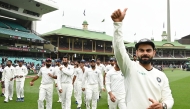 Files: India's captain Virat Kohli (R) gestures as the India team celebrates their series win on the fifth day of the fourth and final cricket Test against Australia at the Sydney Cricket Ground in Sydney on January 7, 2019. (Photo by Peter Parks / AFP)