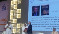 H E Sheikh Faisal bin Qassim Al Thani presenting the award to GU-Q's Dr. Gerd Nonneman at Doha International Book Fair.