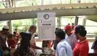 QRCS volunteers distributing food to refugees in Bangladesh.