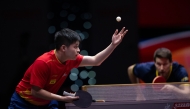 China's Lin Shidong serves to Kristian Karlsson of Sweden. Pic: Xinhua