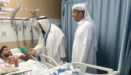 The center officials visiting a patient at a hospital.