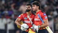Punjab Kings' captain Shreyas Iyer (L) and his teammate Marcus Stoinis celebrate their team's win in the Indian Premier League (IPL) Twenty20 second Qualifier cricket match between Punjab Kings and Mumbai Indians at the Narendra Modi Stadium in Ahmedabad on June 2, 2025. (Photo by Arun SANKAR / AFP)