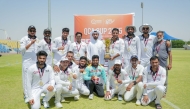 QCA Domestic Cricket Director Abdullah Al Abdullah poses for a photo with the victorious Black Hawks players and officials.