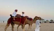 Children enjoying camel rides during the festivities.