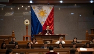 Philippine Senate president Francis Escudero bang the gavel after philippine senators took their oath as jurors in the impeachment trial of Vice President Sara Duterte, with the newly convened court moving to immediately hear a motion to dismiss the case, in Manila on June 10, 2025. (Photo by Ted ALJIBE / AFP)
